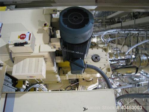 Used PTI (2004) multi layer sheet extrusion line including the following: A) (1) Used PTI model 6000 Trident series 6", 28:1 extruder having a 7-zone electrically heated air cooled barrel at an appro...