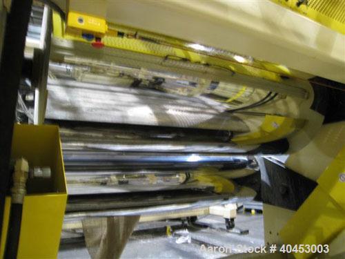 Used PTI (2004) multi layer sheet extrusion line including the following: A) (1) Used PTI model 6000 Trident series 6", 28:1 extruder having a 7-zone electrically heated air cooled barrel at an appro...