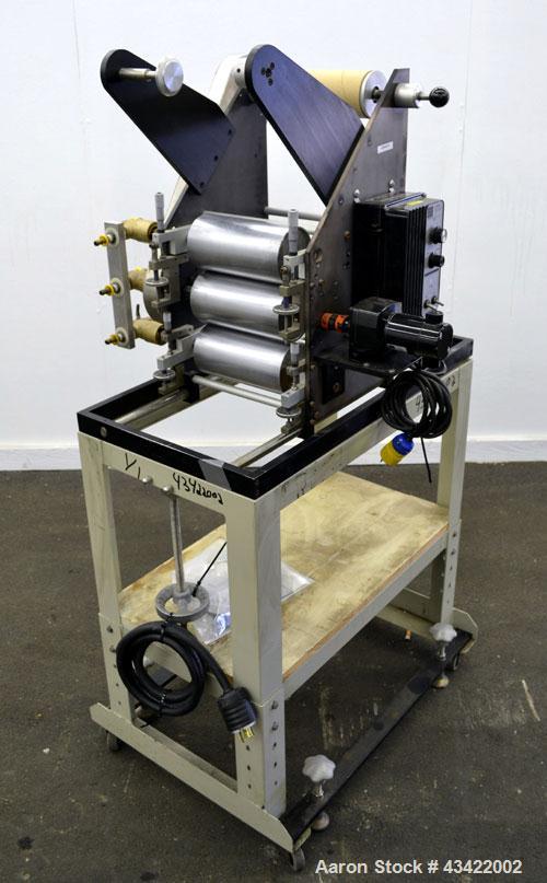 Used C.W. Brabender Univex Lab Take Off. Approximate capacity speeds of up to 30 meters per minute. Consisting of (3) 4” diameter x 8” wide chrome plated, manually adjustable cored rolls, and a top m...