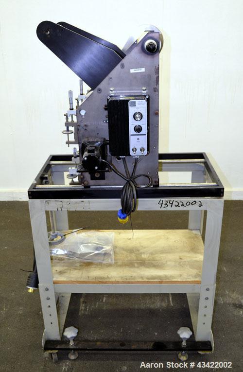 Used C.W. Brabender Univex Lab Take Off. Approximate capacity speeds of up to 30 meters per minute. Consisting of (3) 4” diameter x 8” wide chrome plated, manually adjustable cored rolls, and a top m...