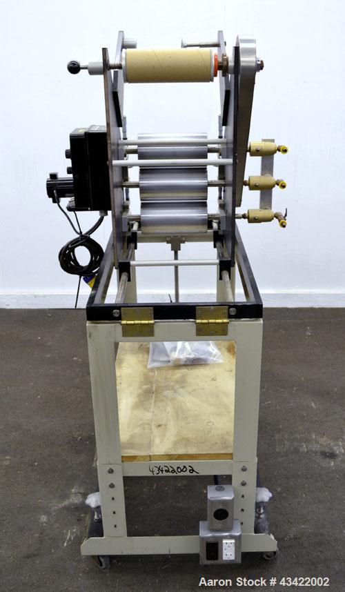 Used C.W. Brabender Univex Lab Take Off. Approximate capacity speeds of up to 30 meters per minute. Consisting of (3) 4” diameter x 8” wide chrome plated, manually adjustable cored rolls, and a top m...