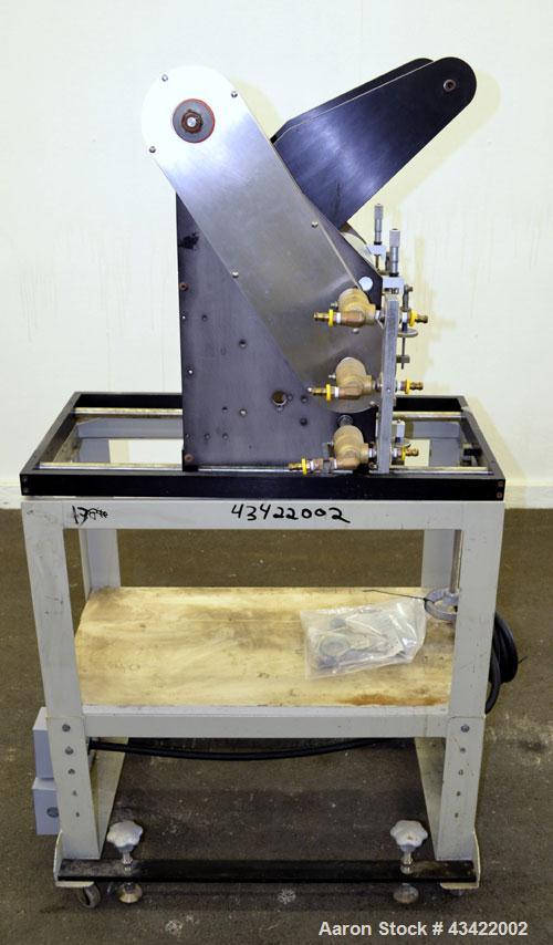 Used C.W. Brabender Univex Lab Take Off. Approximate capacity speeds of up to 30 meters per minute. Consisting of (3) 4” diameter x 8” wide chrome plated, manually adjustable cored rolls, and a top m...