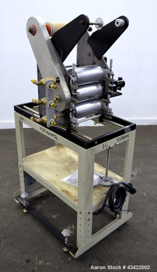 Used C.W. Brabender Univex Lab Take Off. Approximate capacity speeds of up to 30 meters per minute. Consisting of (3) 4” diameter x 8” wide chrome plated, manually adjustable cored rolls, and a top m...