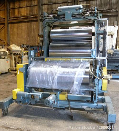 Used Crown Sheet Take Off System Consisting Of: (1) Crown 3 roll vertical down sheet stack. (2) 32'' Diameter x 60'' wide chrome plated cored rolls, (1) 18'' diameter x 60'' wide chrome plated cored ...