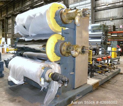 Used Crown Sheet Take Off System Consisting Of: (1) Crown 3 roll "J" sheet stack. (2) 30" Diameter x 60" wide chrome plated cored rolls, (1) 18" diameter x 60" wide movable bottom chrome plated cored...