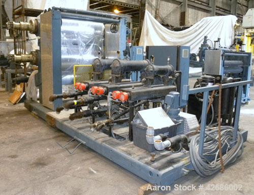 Used Crown Sheet Take Off System Consisting Of: (1) Crown 3 roll "J" sheet stack. (2) 30" Diameter x 60" wide chrome plated cored rolls, (1) 18" diameter x 60" wide movable bottom chrome plated cored...