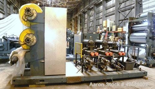 Used Crown Sheet Take Off System Consisting Of: (1) Crown 3 roll "J" sheet stack. (2) 30" Diameter x 60" wide chrome plated cored rolls, (1) 18" diameter x 60" wide movable bottom chrome plated cored...