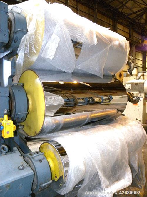 Used Crown Sheet Take Off System Consisting Of: (1) Crown 3 roll "J" sheet stack. (2) 30" Diameter x 60" wide chrome plated cored rolls, (1) 18" diameter x 60" wide movable bottom chrome plated cored...