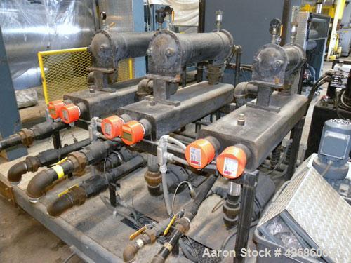 Used Crown Sheet Take Off System Consisting Of: (1) Crown 3 roll "J" sheet stack. (2) 30" Diameter x 60" wide chrome plated cored rolls, (1) 18" diameter x 60" wide movable bottom chrome plated cored...