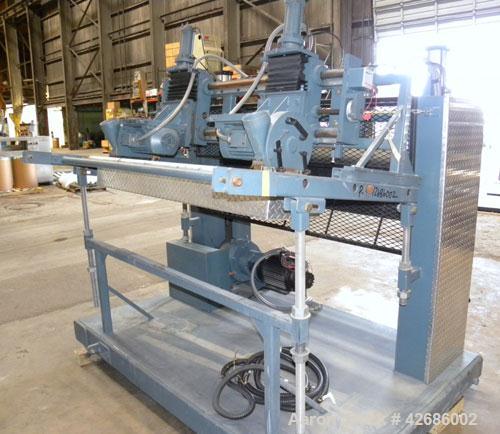 Used Crown Sheet Take Off System Consisting Of: (1) Crown 3 roll "J" sheet stack. (2) 30" Diameter x 60" wide chrome plated cored rolls, (1) 18" diameter x 60" wide movable bottom chrome plated cored...
