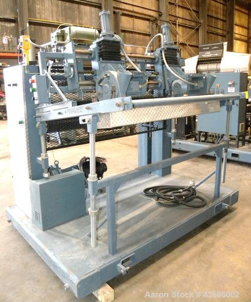 Used Crown Sheet Take Off System Consisting Of: (1) Crown 3 roll "J" sheet stack. (2) 30" Diameter x 60" wide chrome plated cored rolls, (1) 18" diameter x 60" wide movable bottom chrome plated cored...