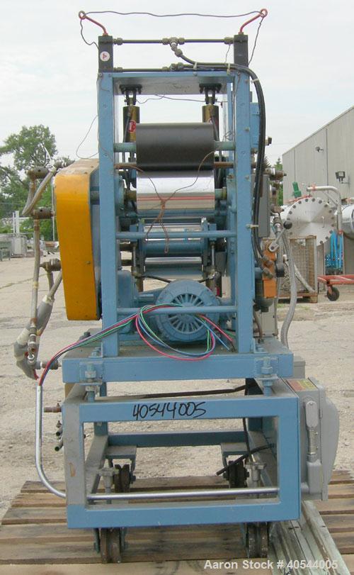 Used Killion 3 roll sheet stack. (3) 5" diameter x 8" wide chrome plated cored rolls, pneumatically adjustable, (1) 5" diameter x 8" wide chrome, (1) 5" diameter x 8" wide rubber pull roll, pneumatic...