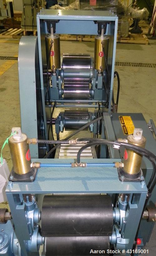 Used Killion 3 Roll Sheet Stack. (3) 10" Diameter x 10" wide chrome plated cored rolls, pneumatically adjustable. Driven by a 2 hp, 180 volt, 1750/2050 rpm DC gear motor, ratio 60 to 1.  (1) Pull rol...