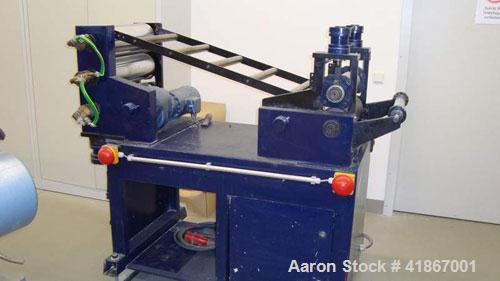 Used Leistriz Lab Size 3 Roll Sheet Stack. (3) 5.85" diameter x 15.6" straight side, 2 fixed and 1 removable chromed rolls, steam heated rolls. Includes downstream/haul-off. (2) Gearboxes driven by (...