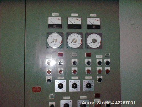 Used Sumitomo Heavy Industries EC 075-T Tandem Extrusion Coating Line, laminator for producing laminated foil for tubes for cosmetic production. Capable of producing ABL foil from 5 layer film with a...