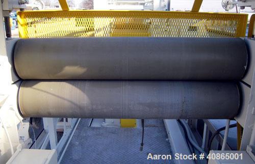  (1) 3 roll sheet stack with (3) 12" diameter x 41" wide chrome plated rolls, and (2) 12" diameter x 41" wide pattern rolls, with pumps, heat exchangers, control panel, and 16' long cooling section. ...