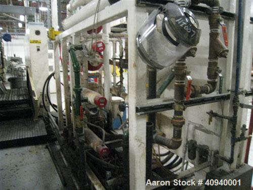 Used Welex Co-Extrusion Sheet Line consisting of the following:  (1) Welex 4.5" screw diameter, 36:1 L/D ratio. Electrically heated, water cooled side vented barrel. Unit driven by a 250 hp DC motor ...