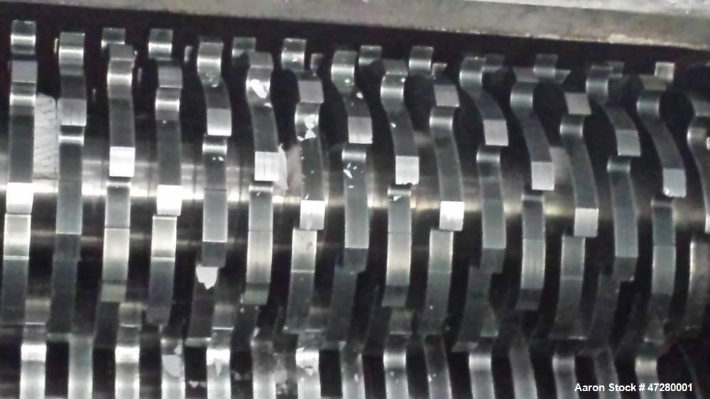 Used Untha Four Shaft Shredder, Model RS40. 2 x 15kw. Cutting chamber 750 x 700. Extra pushing fuction, pusher is connected via a PLC. Mfg. 1995.