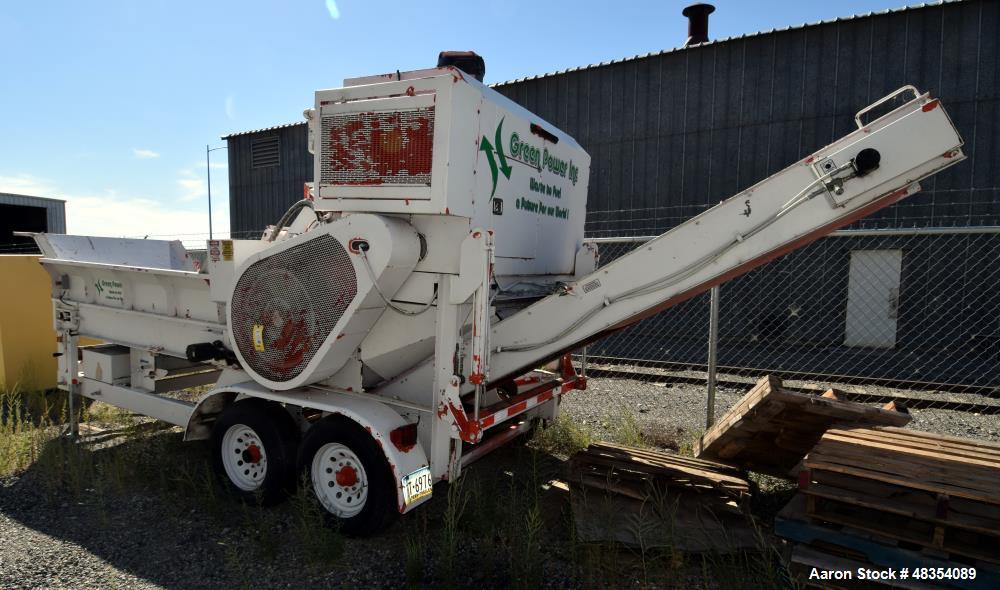 Used Diesel driven shredder trailer. With a 53" wide rotor, 54" wide infeed conveyor, 36" wide discharge conveyor, John Deere 6.8 liter PowerTech diesel engine. Mounted on a dual axel trailer.
