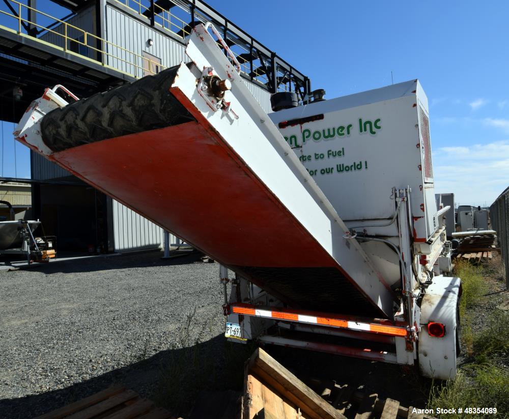 Used Diesel driven shredder trailer. With a 53" wide rotor, 54" wide infeed conveyor, 36" wide discharge conveyor, John Deere 6.8 liter PowerTech diesel engine. Mounted on a dual axel trailer.