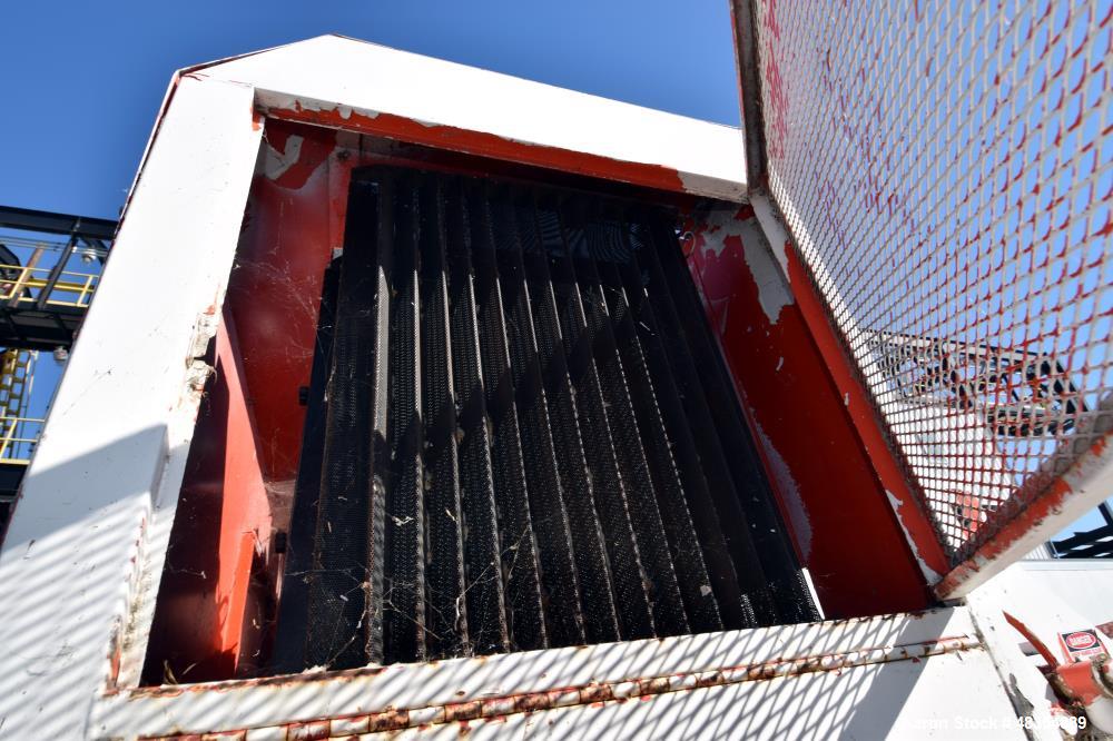 Used Diesel driven shredder trailer. With a 53" wide rotor, 54" wide infeed conveyor, 36" wide discharge conveyor, John Deere 6.8 liter PowerTech diesel engine. Mounted on a dual axel trailer.