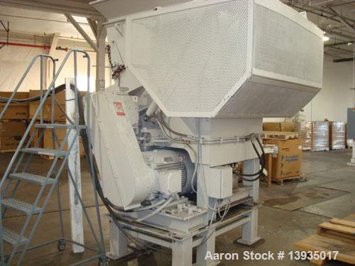 Used-EconoGrind single shaft shredder, model ESS 1200. Feed throat opening 55.9" x 49.4", rotor diameter 18", hyd ram, 100 h...