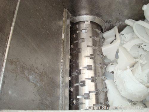 Used EconoGrind single shaft shredder, model ESS 1200. Feed throat opening 55.9" x 49.4", rotor diameter 18", hyd ram, 100 hp with controls.