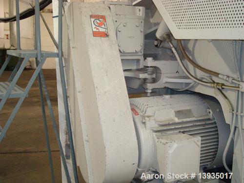 Used EconoGrind single shaft shredder, model ESS 1200. Feed throat opening 55.9" x 49.4", rotor diameter 18", hyd ram, 100 hp with controls.