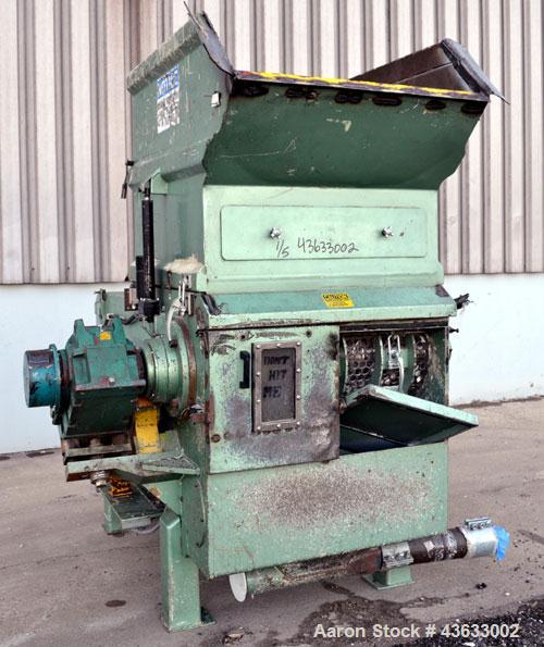 Used Uni-Shred Single Shaft Shredder, Carbon Steel. Approximately 14” diameter x 44” wide rotor with bolt-on cutters. Approximately 40-1/2” x 44-1/2” feed opening with hopper. Single ram horizontal h...