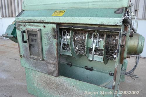 Used Uni-Shred Single Shaft Shredder, Carbon Steel. Approximately 14” diameter x 44” wide rotor with bolt-on cutters. Approximately 40-1/2” x 44-1/2” feed opening with hopper. Single ram horizontal h...