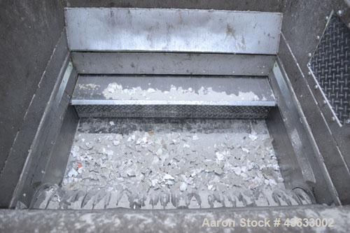 Used Uni-Shred Single Shaft Shredder, Carbon Steel. Approximately 14” diameter x 44” wide rotor with bolt-on cutters. Approximately 40-1/2” x 44-1/2” feed opening with hopper. Single ram horizontal h...