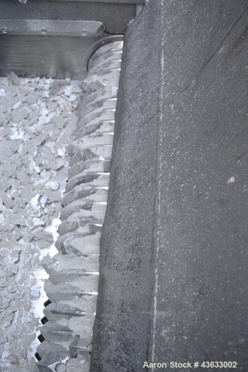 Used Uni-Shred Single Shaft Shredder, Carbon Steel. Approximately 14” diameter x 44” wide rotor with bolt-on cutters. Approximately 40-1/2” x 44-1/2” feed opening with hopper. Single ram horizontal h...