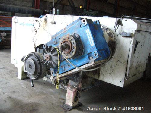 Used Uni-Shred Single Rotor Shredder, carbon steel. 63" x 67" feed. Hydraulic ram feeder. Shreddder driven by a 150 hp motor. Includes belt discharge conveyor.
