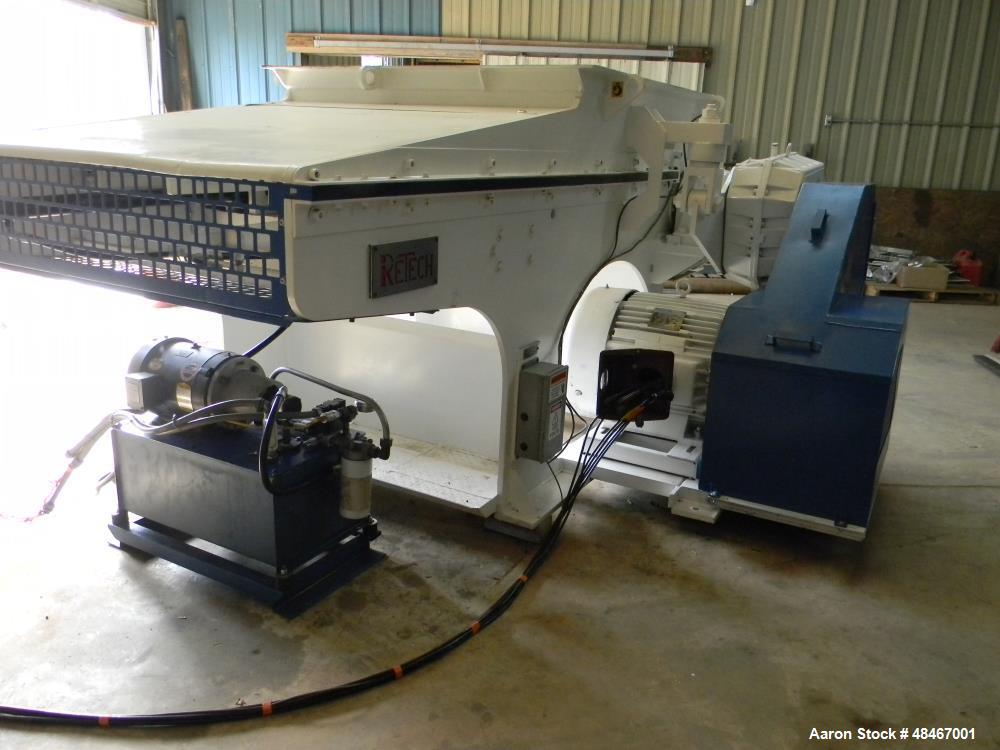 Used Retech Shredder/Grinder, Model 52/100. 40 mm rotating cutters with 4 points. Changeable counter knife. 100 hp motor with new fluid drive coupling and a rebuilt link belt gear box. Control panel....