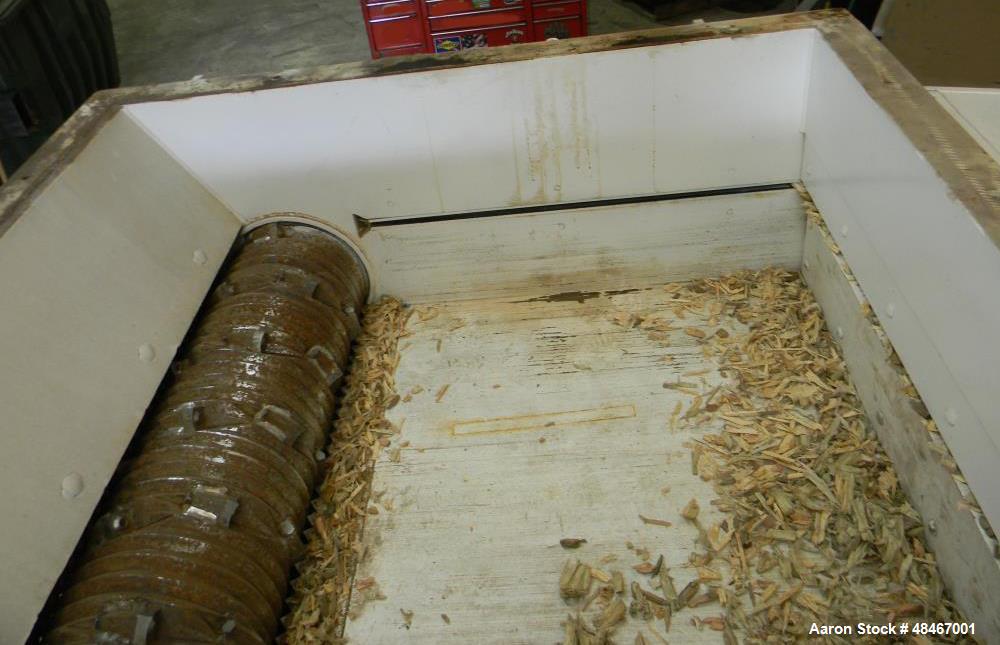 Used Retech Shredder/Grinder, Model 52/100. 40 mm rotating cutters with 4 points. Changeable counter knife. 100 hp motor with new fluid drive coupling and a rebuilt link belt gear box. Control panel....