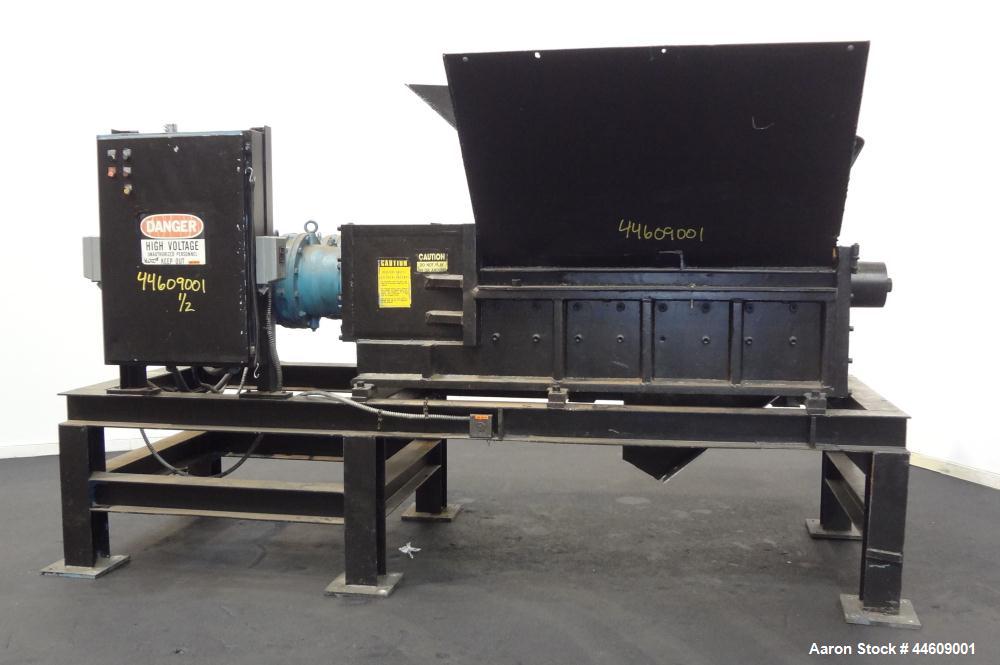 Used Shred-Pax Twin Shaft Shredder, Model AZ-80 EP, Carbon Steel. (2) Rows of intermeshing hook knives approximately 1-3/4" thick. 34" x 52" Feed opening with a hopper, bottom discharge. Each shaft d...