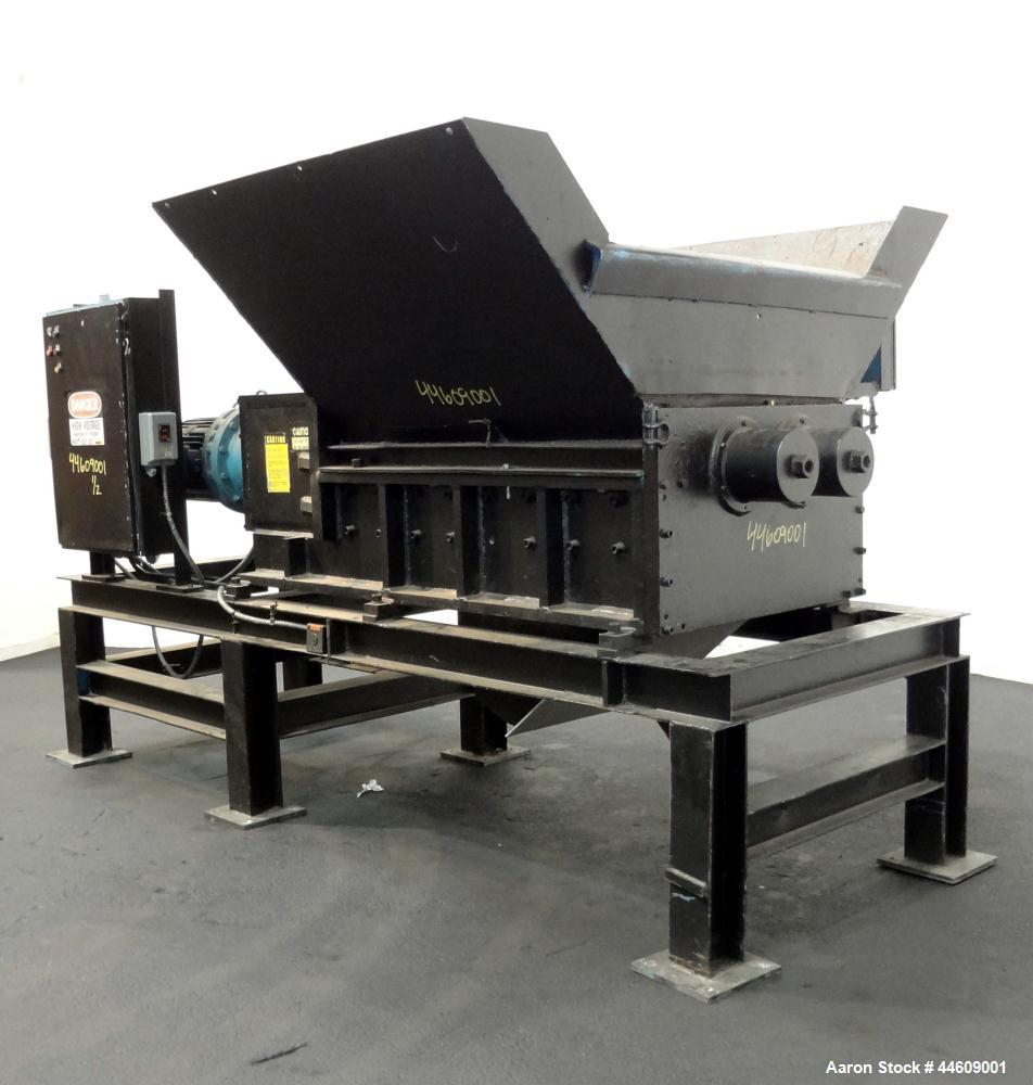 Used Shred-Pax Twin Shaft Shredder, Model AZ-80 EP, Carbon Steel. (2) Rows of intermeshing hook knives approximately 1-3/4" thick. 34" x 52" Feed opening with a hopper, bottom discharge. Each shaft d...