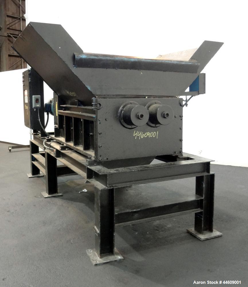 Used Shred-Pax Twin Shaft Shredder, Model AZ-80 EP, Carbon Steel. (2) Rows of intermeshing hook knives approximately 1-3/4" thick. 34" x 52" Feed opening with a hopper, bottom discharge. Each shaft d...