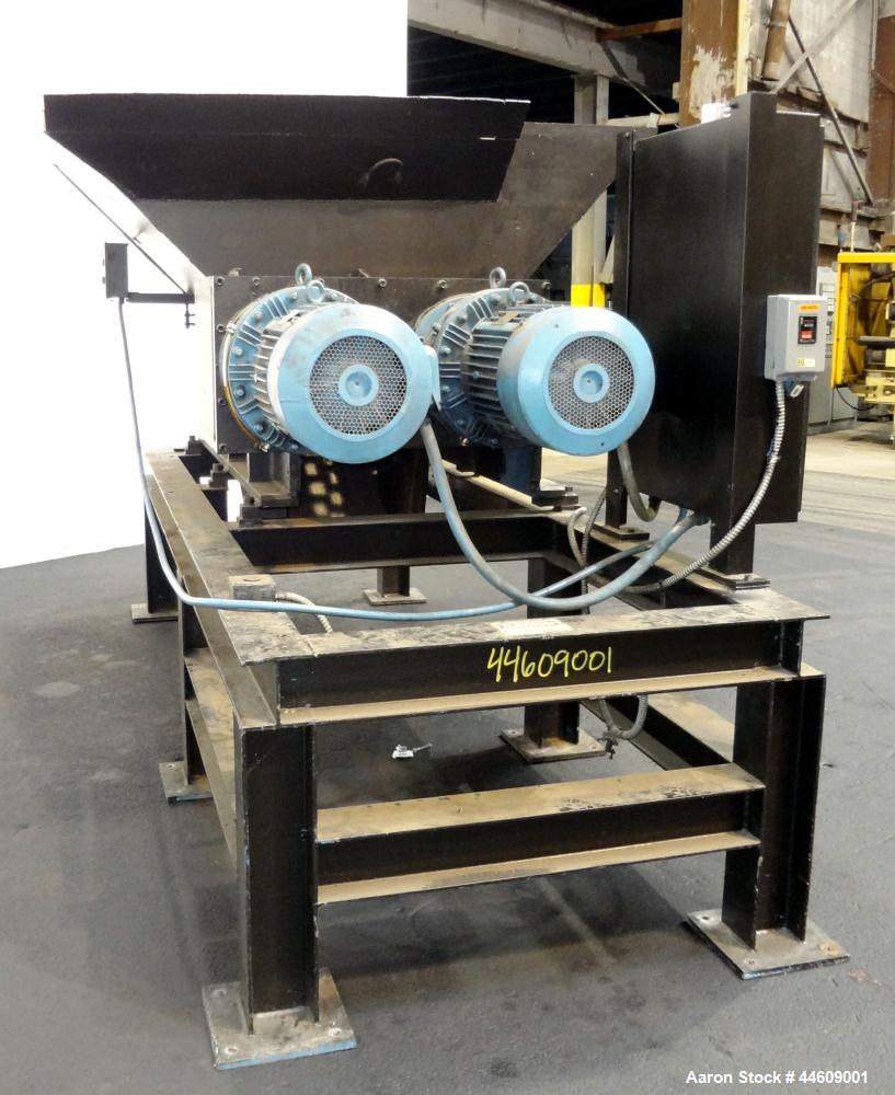 Used Shred-Pax Twin Shaft Shredder, Model AZ-80 EP, Carbon Steel. (2) Rows of intermeshing hook knives approximately 1-3/4" thick. 34" x 52" Feed opening with a hopper, bottom discharge. Each shaft d...