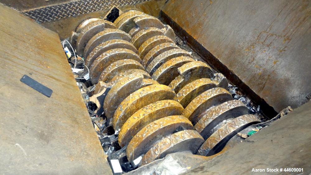Used Shred-Pax Twin Shaft Shredder, Model AZ-80 EP, Carbon Steel. (2) Rows of intermeshing hook knives approximately 1-3/4" thick. 34" x 52" Feed opening with a hopper, bottom discharge. Each shaft d...