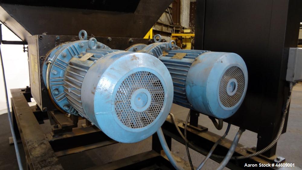 Used Shred-Pax Twin Shaft Shredder, Model AZ-80 EP, Carbon Steel. (2) Rows of intermeshing hook knives approximately 1-3/4" thick. 34" x 52" Feed opening with a hopper, bottom discharge. Each shaft d...