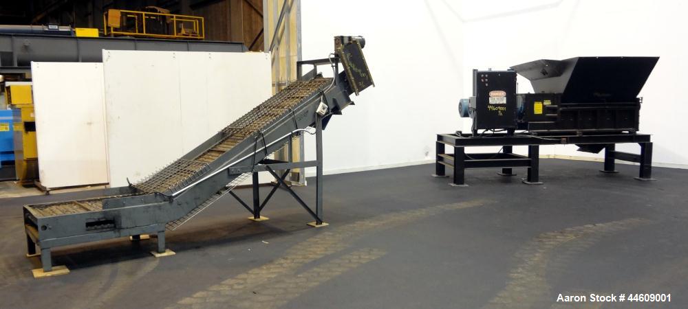 Used Shred-Pax Twin Shaft Shredder, Model AZ-80 EP, Carbon Steel. (2) Rows of intermeshing hook knives approximately 1-3/4" thick. 34" x 52" Feed opening with a hopper, bottom discharge. Each shaft d...