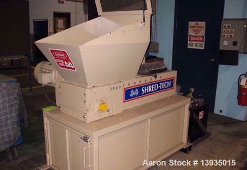 Used Shred-Tech Model STS-7 Single Shaft Shredder. 12.5" x 24" hopper opening, ram feed, 10 hp, approximately 10 hours of use.