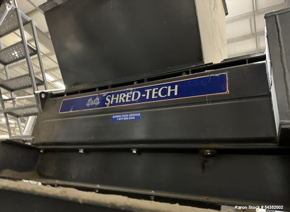 Used Shred-Tech Dual Shaft Shredder. With dual 30hp motor, feed hopper, stand, panel.