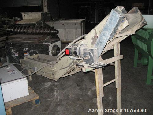 Used Vecoplan Model RG42/30WP Shredder. 30 Hp, 460 volt drive motor into gearbox, belt drive, 10" diameter 42" wide rotor with 27 indexable cutters at 120 rpm, 1.4 kW hydraulic ram motor, 2.9 cubic y...