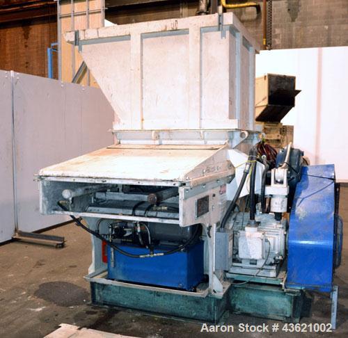 Used Vecoplan/Re-Tech Single Shaft Shredder, Carbon Steel. Approximately 14” diameter x 42” wide rotor with bolt-on cutters. Approximate 44” x 49” feed opening with bolt on hopper. Dual ram horizonta...