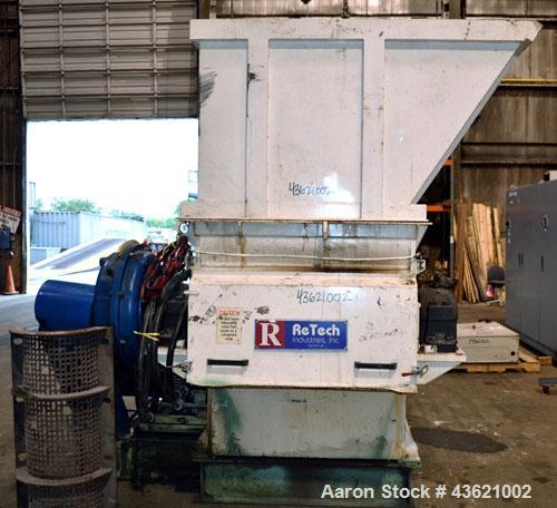 Used Vecoplan/Re-Tech Single Shaft Shredder, Carbon Steel. Approximately 14” diameter x 42” wide rotor with bolt-on cutters. Approximate 44” x 49” feed opening with bolt on hopper. Dual ram horizonta...