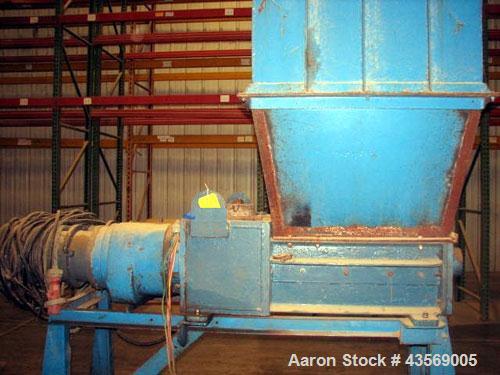 Used Weil Twin Shaft Shredder, Carbon Steel. Independently driven shafts with 15 hp, 440 volt motors on each shaft. Approximate 20" x 28" feed opening, 1.25" wide blades. Includes feed hopper, and st...