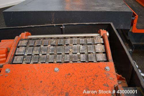 Used Weima Slow Speed Shredder, Model WLH600S/45 Leopard, Carbon Steel. Approximately 368mm (14.4" diameter) x 24" wide (32) bolt on blade  V rotor, driven by a 45 kw (60 hp), 3/60/460 volt, 1770 rpm...