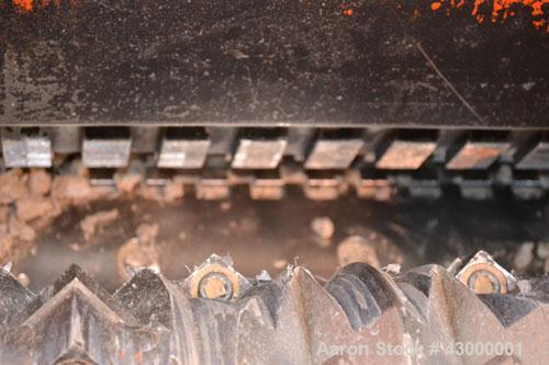 Used Weima Slow Speed Shredder, Model WLH600S/45 Leopard, Carbon Steel. Approximately 368mm (14.4" diameter) x 24" wide (32) bolt on blade  V rotor, driven by a 45 kw (60 hp), 3/60/460 volt, 1770 rpm...